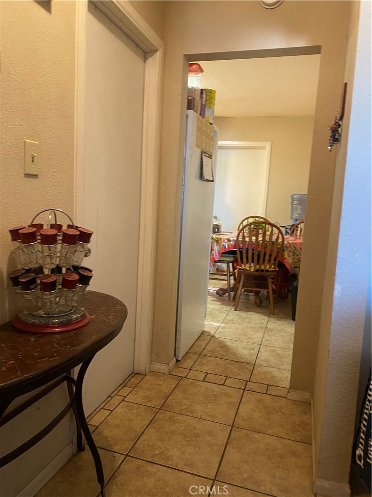 12065 Aztec Lane Adelanto, CA 92301 - Photo 41 of 64 a room with a table and chairs