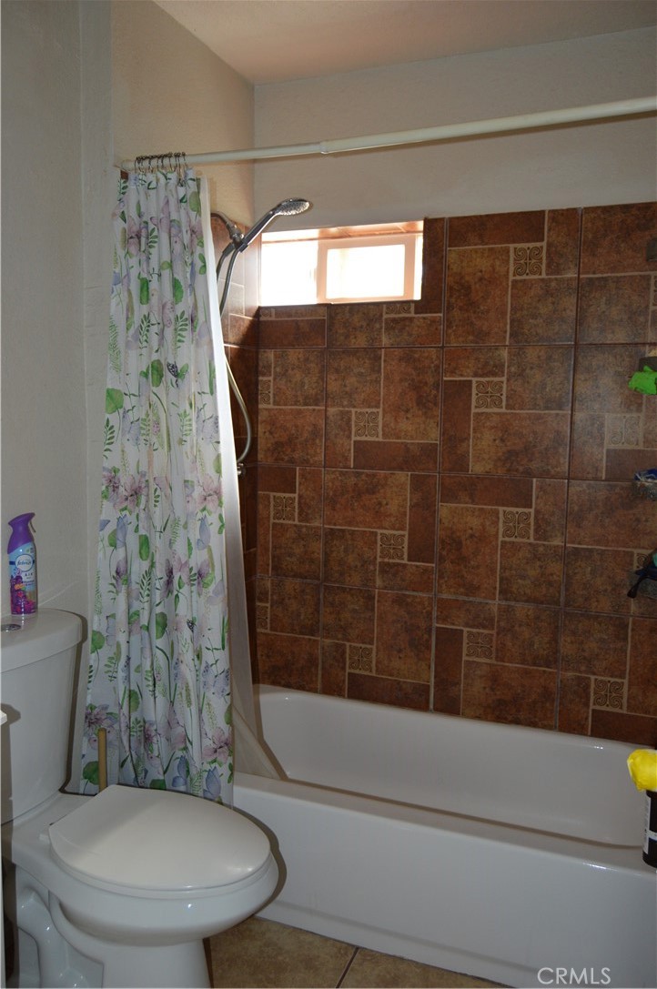 12065 Aztec Lane Adelanto, CA 92301 - Photo 55 of 64 a bathroom with a toilet and shower