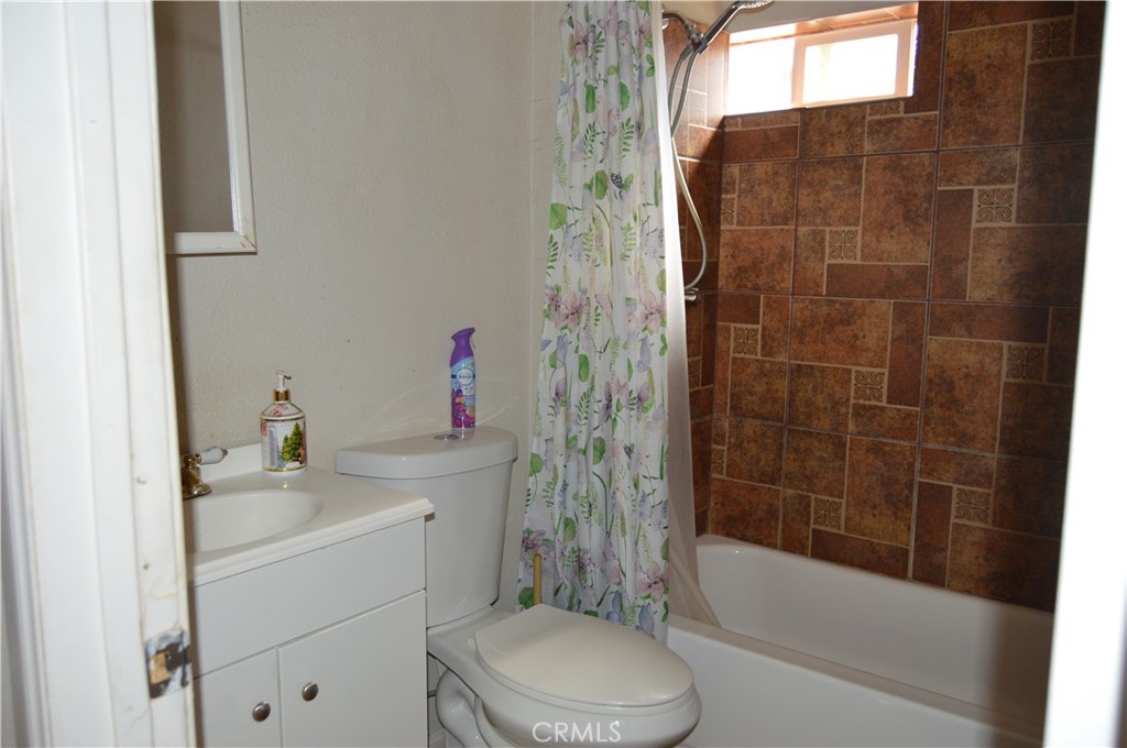 12065 Aztec Lane Adelanto, CA 92301 - Photo 56 of 64 a bathroom with a sink toilet and shower