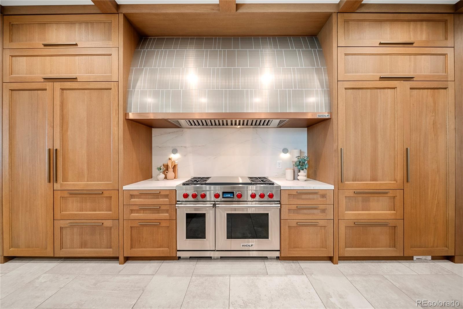 12565 Picadilly Road Commerce City, CO 80022 - Photo 12 of 50 a kitchen with stainless steel appliances and cabinets