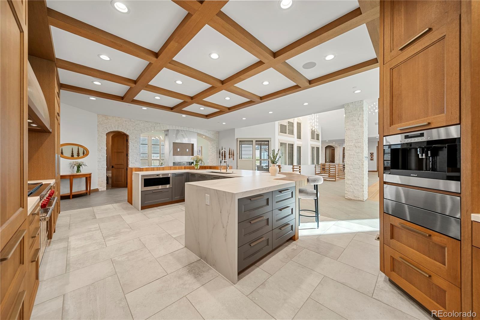 12565 Picadilly Road Commerce City, CO 80022 - Photo 13 of 50 a kitchen with stainless steel appliances granite countertop a stove and a refrigerator