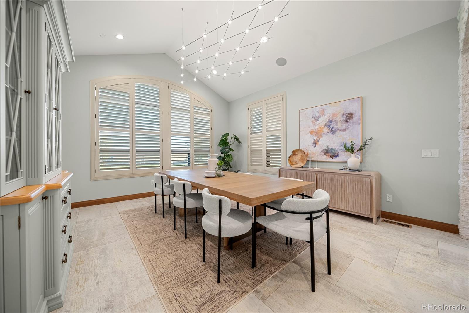 12565 Picadilly Road Commerce City, CO 80022 - Photo 16 of 50 a dining room with a table and chairs