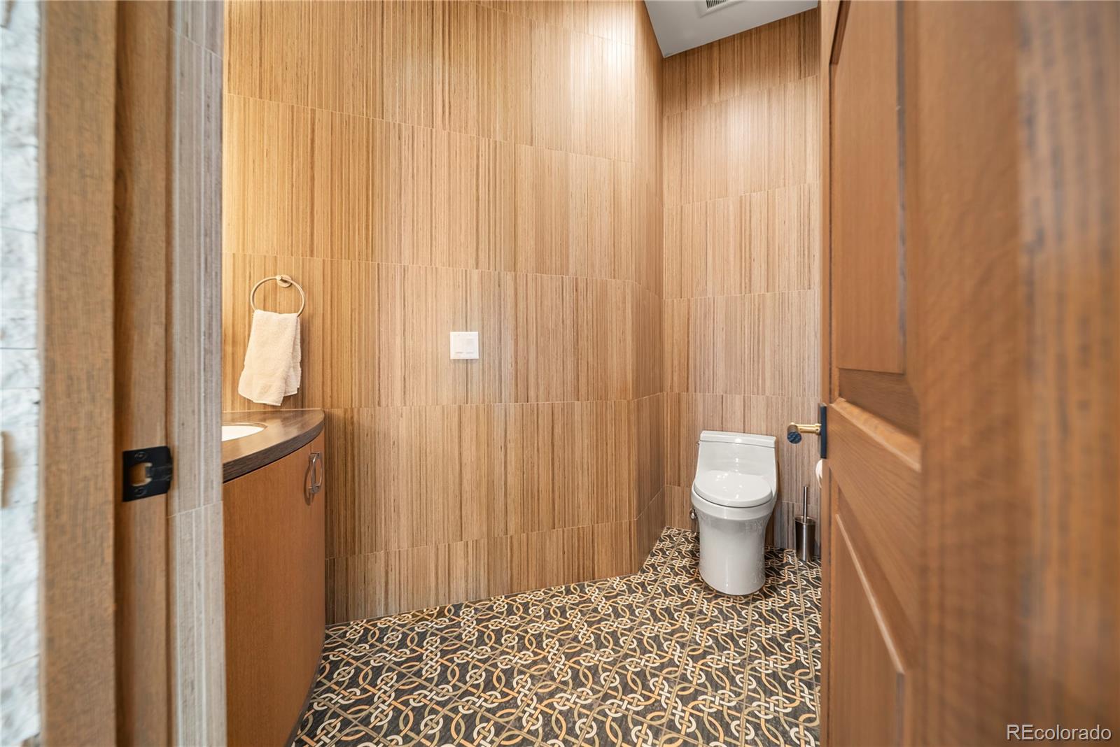 12565 Picadilly Road Commerce City, CO 80022 - Photo 17 of 50 a bathroom with a toilet and a shower curtain