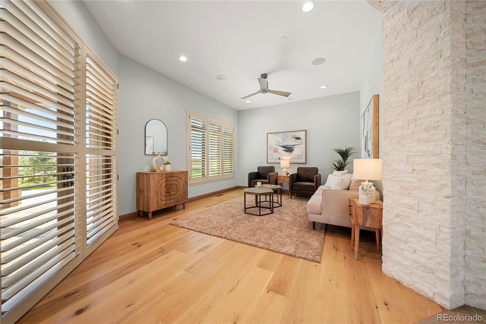 12565 Picadilly Road Commerce City, CO 80022 - Photo 19 of 50 a living room with furniture and a window
