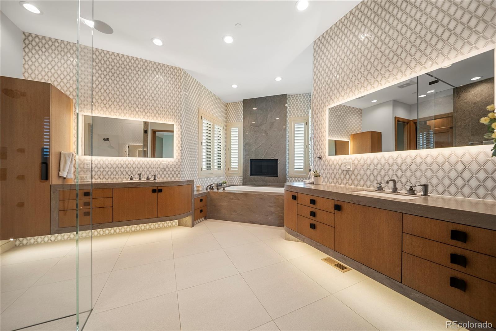 12565 Picadilly Road Commerce City, CO 80022 - Photo 26 of 50 a spacious bathroom with a granite countertop sink mirror and bathtub