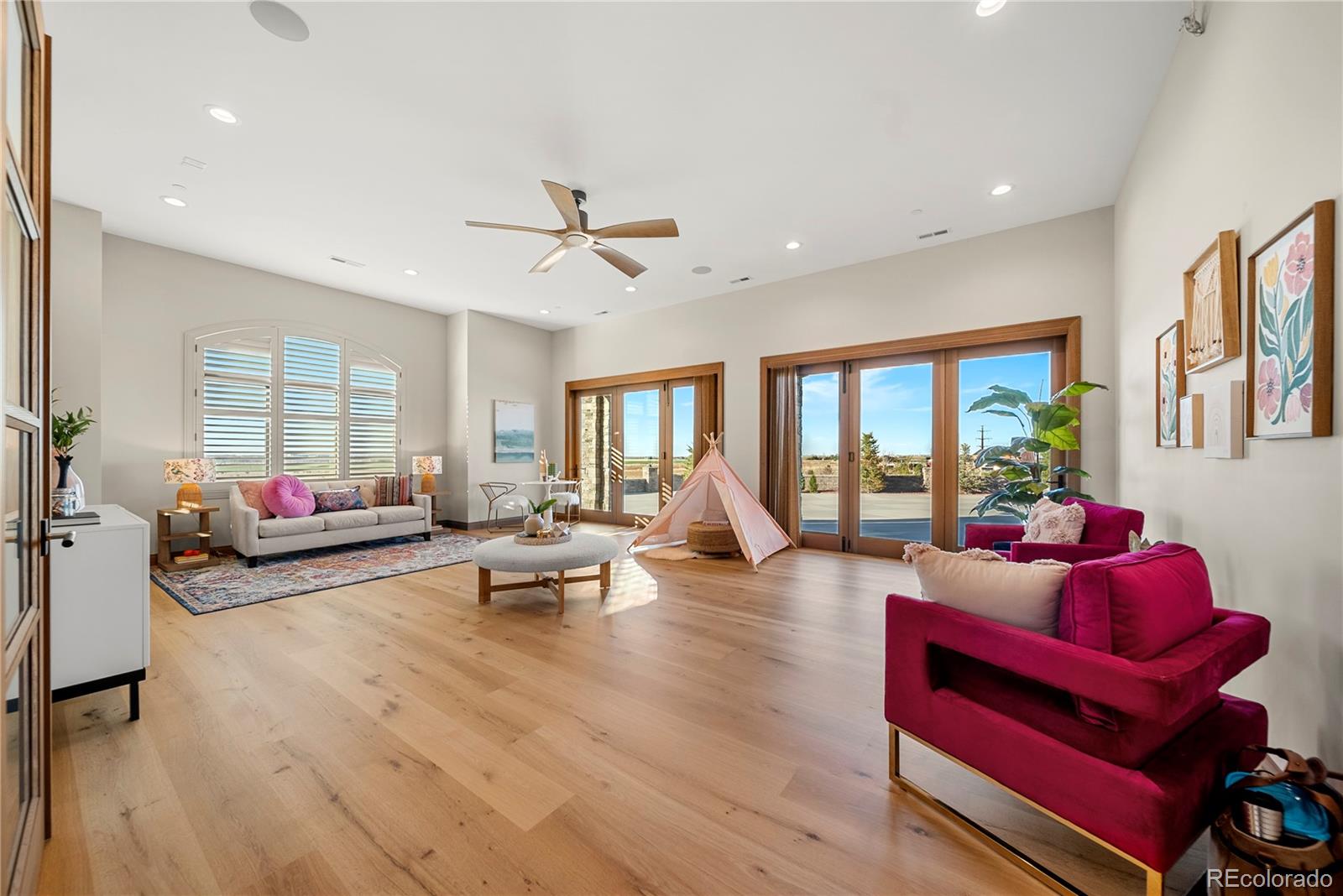 12565 Picadilly Road Commerce City, CO 80022 - Photo 30 of 50 a living room with furniture window and wooden floor
