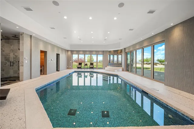 a view of a living room and chandelier