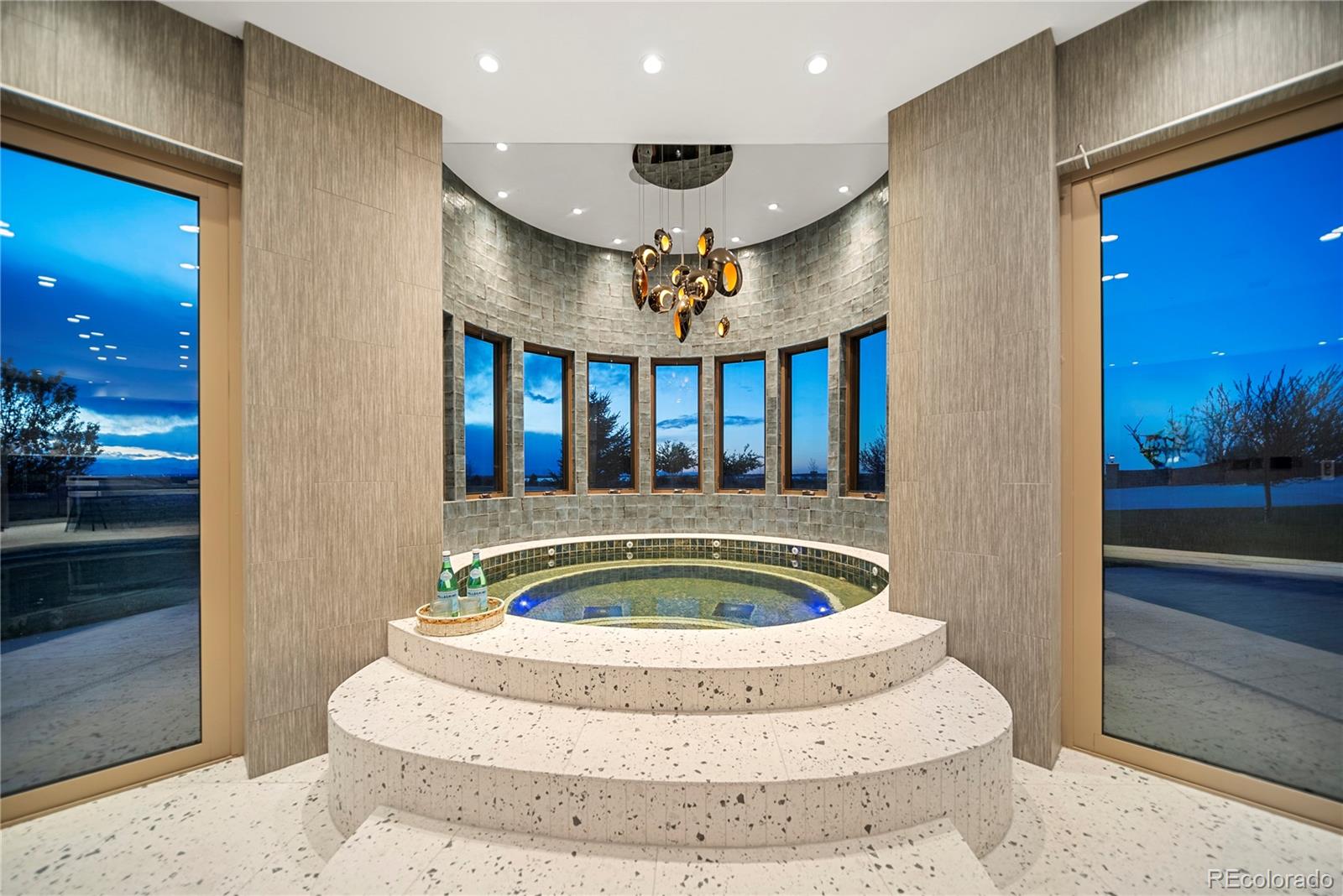 12565 Picadilly Road Commerce City, CO 80022 - Photo 40 of 50 a view of a living room and chandelier