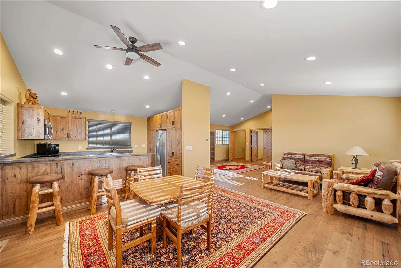 12565 Picadilly Road Commerce City, CO 80022 - Photo 49 of 50 a living room with furniture and kitchen view