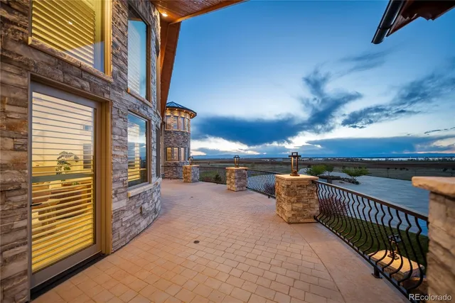 a view of a balcony with furniture