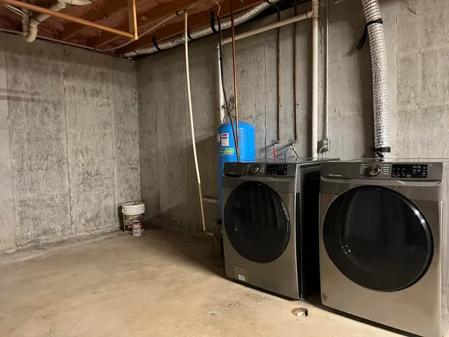 a utility room with dryer and washer