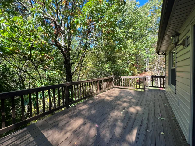 a view of balcony with wooden floor