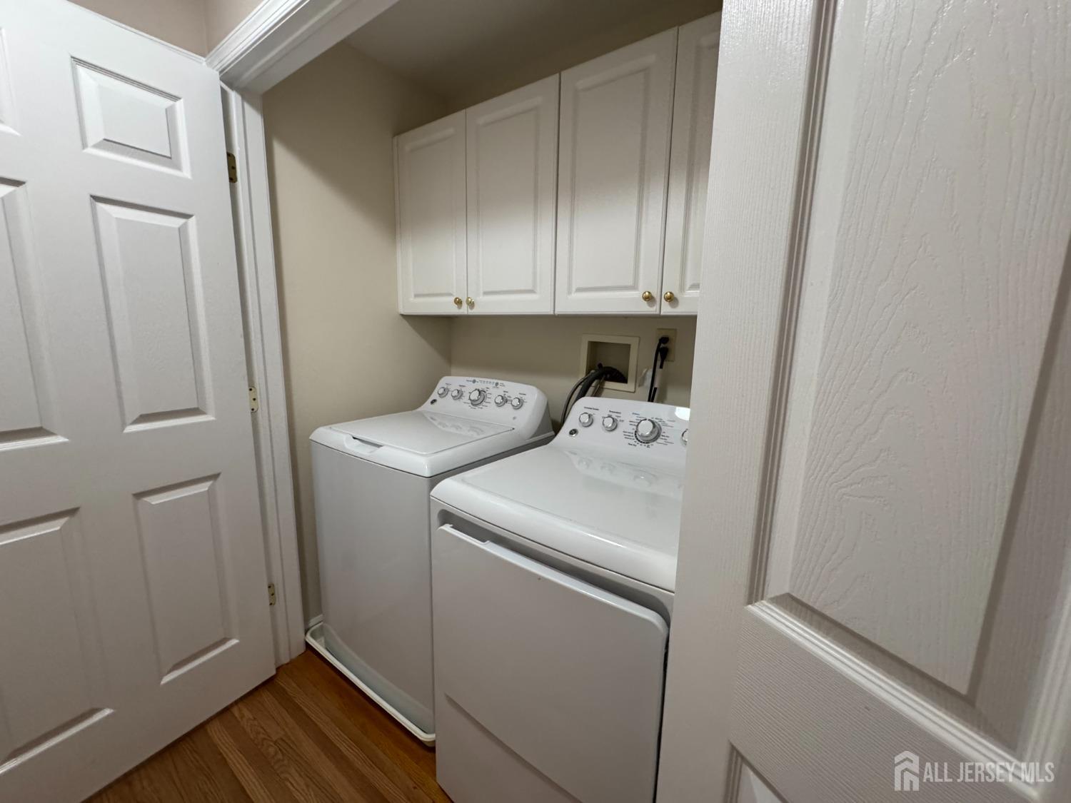 566 Cliff Road, Unit C Sewaren, NJ 07077 - Photo 13 of 14 a utility room with dryer and washer