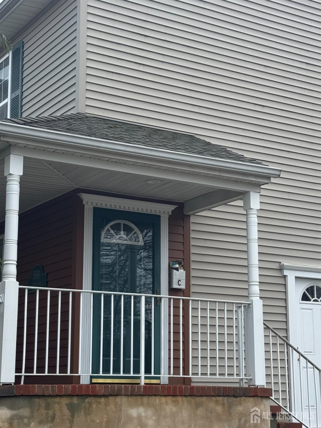 566 Cliff Road, Unit C Sewaren, NJ 07077 - Photo 3 of 14 a view of a house with a door