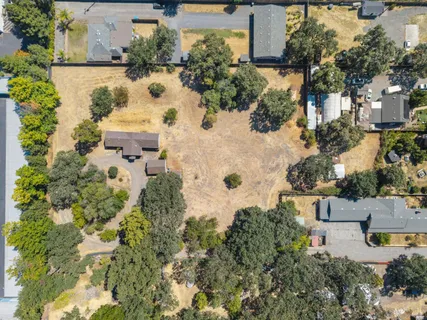 an aerial view of houses with yard