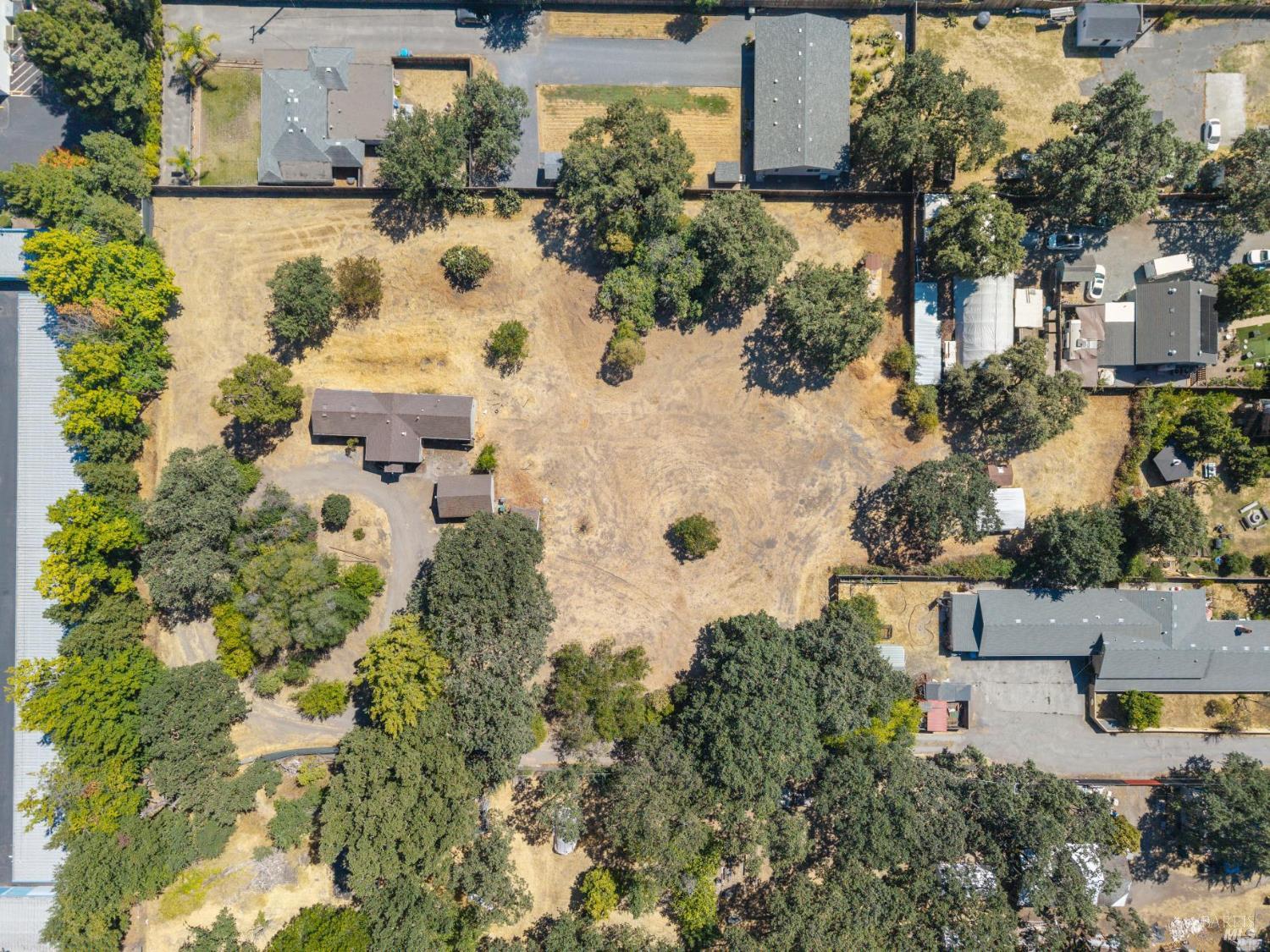 an aerial view of houses with yard