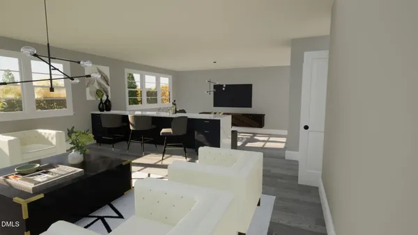 a living room with furniture a flat screen tv and a floor