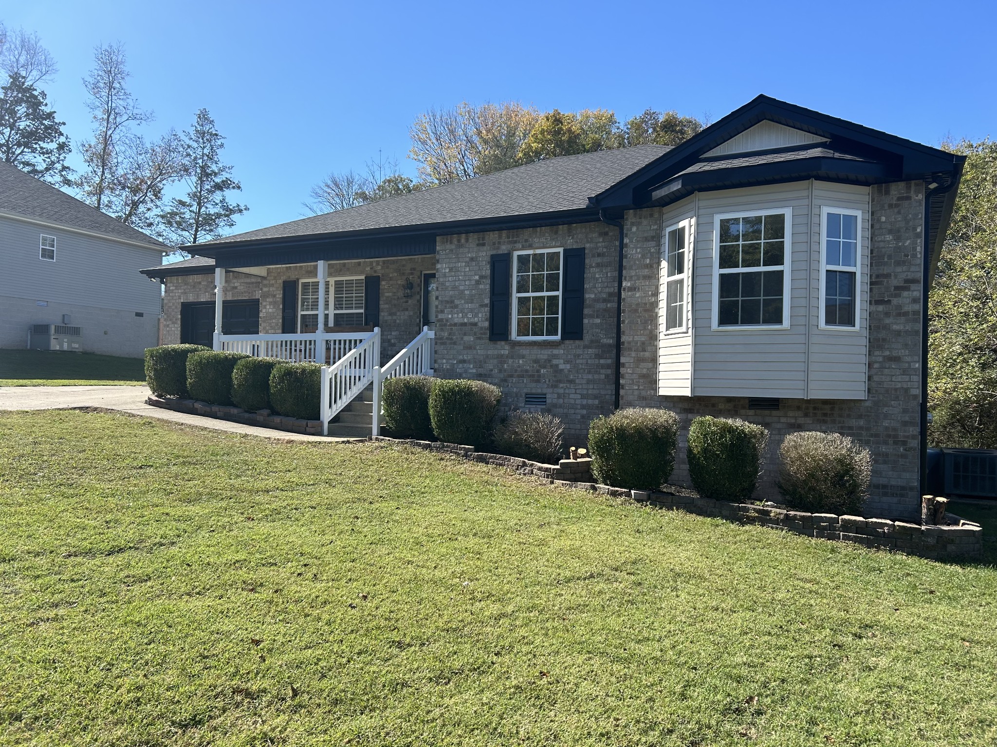 4266 Birmingham Road Lebanon, TN 37090 - Photo 1 of 24 a front view of a house with a yard and garage