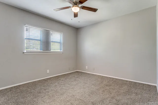 a bathroom with a sink toilet and a mirror