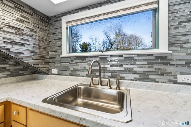 a kitchen with a sink and a window