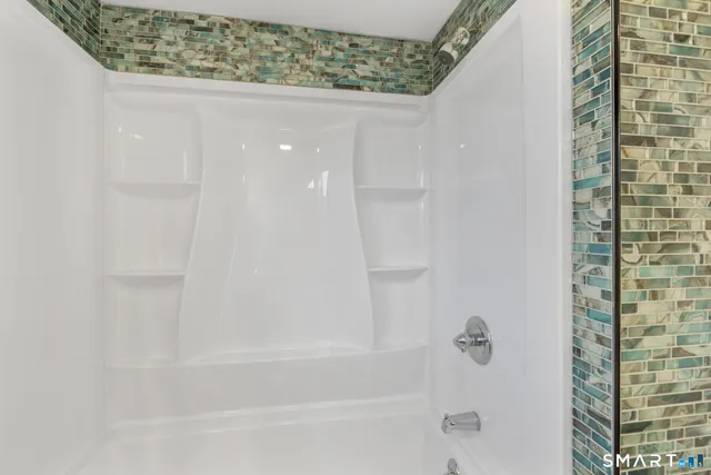 a close up of a bathtub curtain