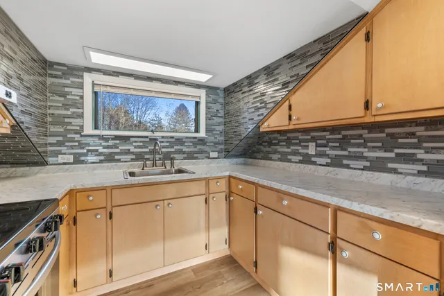 a view of a sink and a microwave