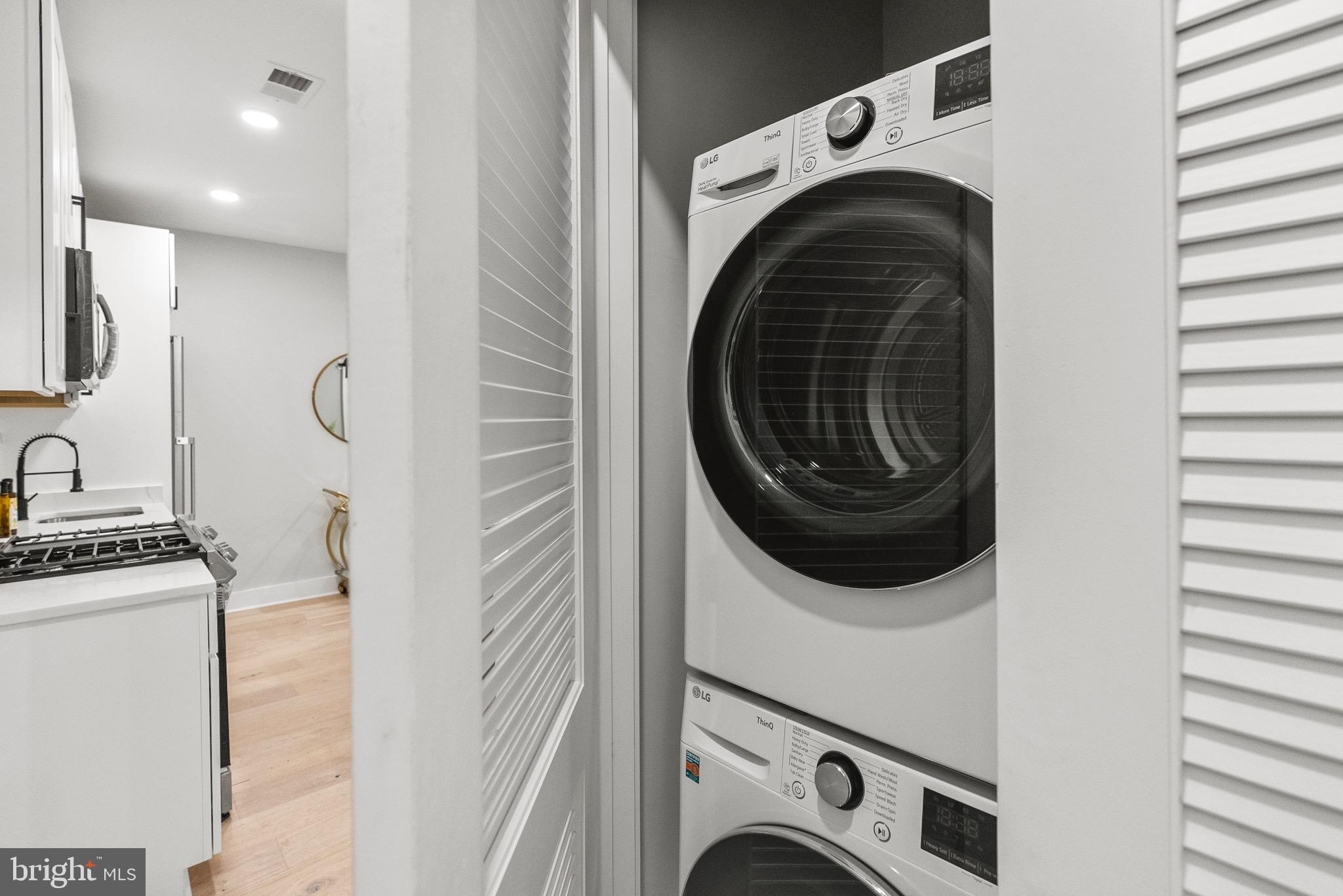 2019 M Street Northeast, Unit 1 Washington, DC 20002 - Photo 17 of 31 a utility room with dryer and washer