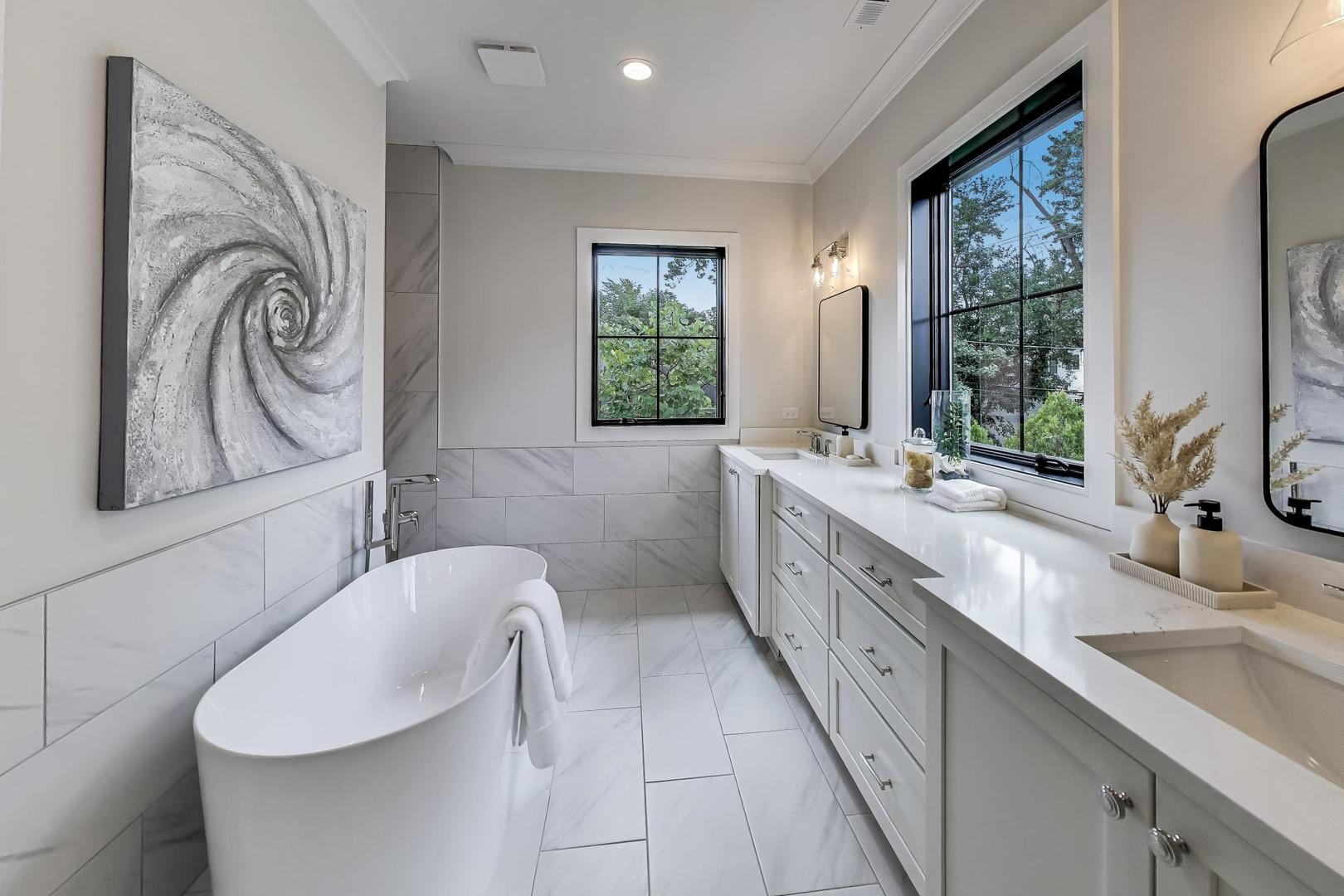 405 Ridge Avenue Clarendon Hills, IL 60514 - Photo 13 of 17 a bathroom with a double vanity sink a mirror and a bathtub