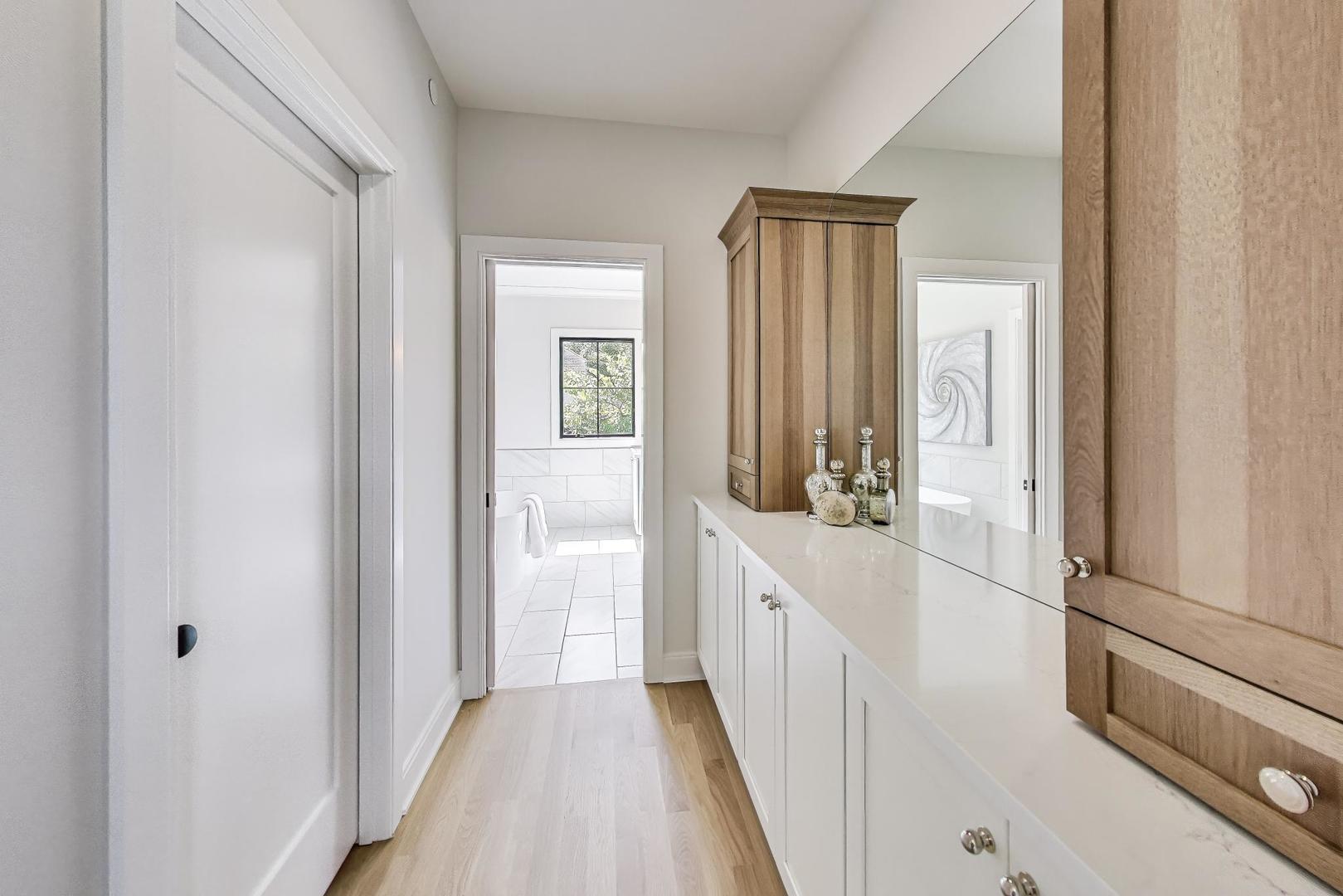405 Ridge Avenue Clarendon Hills, IL 60514 - Photo 14 of 17 a view of a hallway with wooden floor and staircase