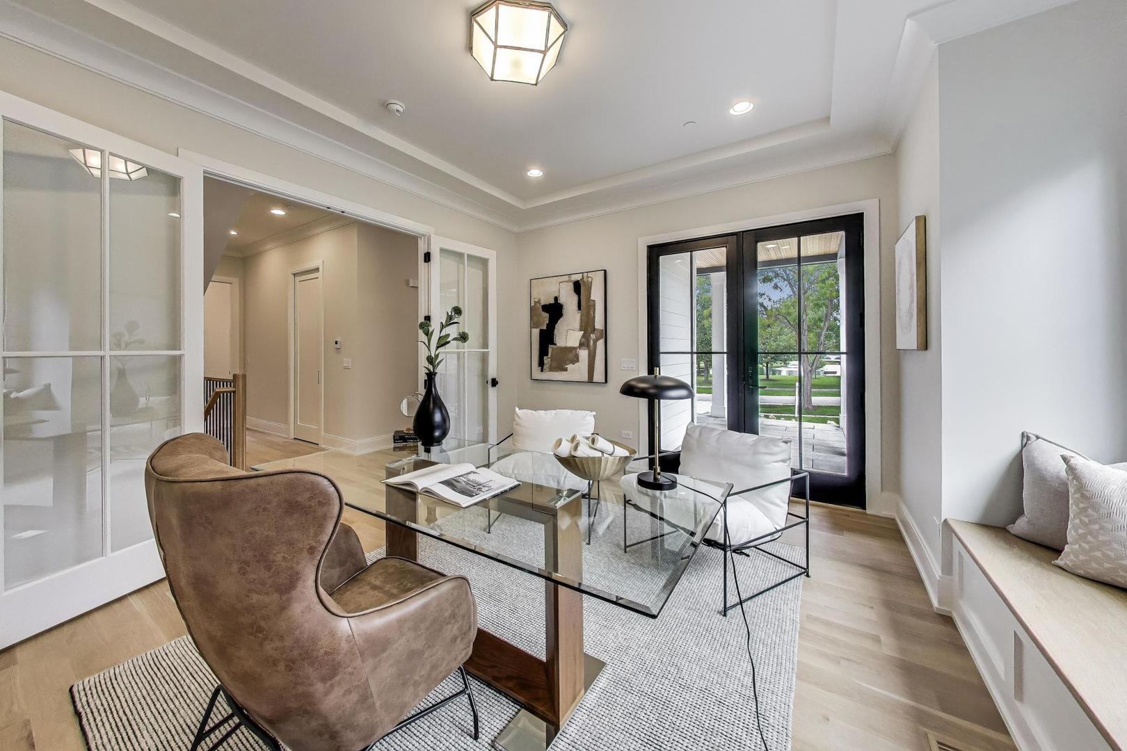 405 Ridge Avenue Clarendon Hills, IL 60514 - Photo 3 of 17 a living room with furniture and large windows