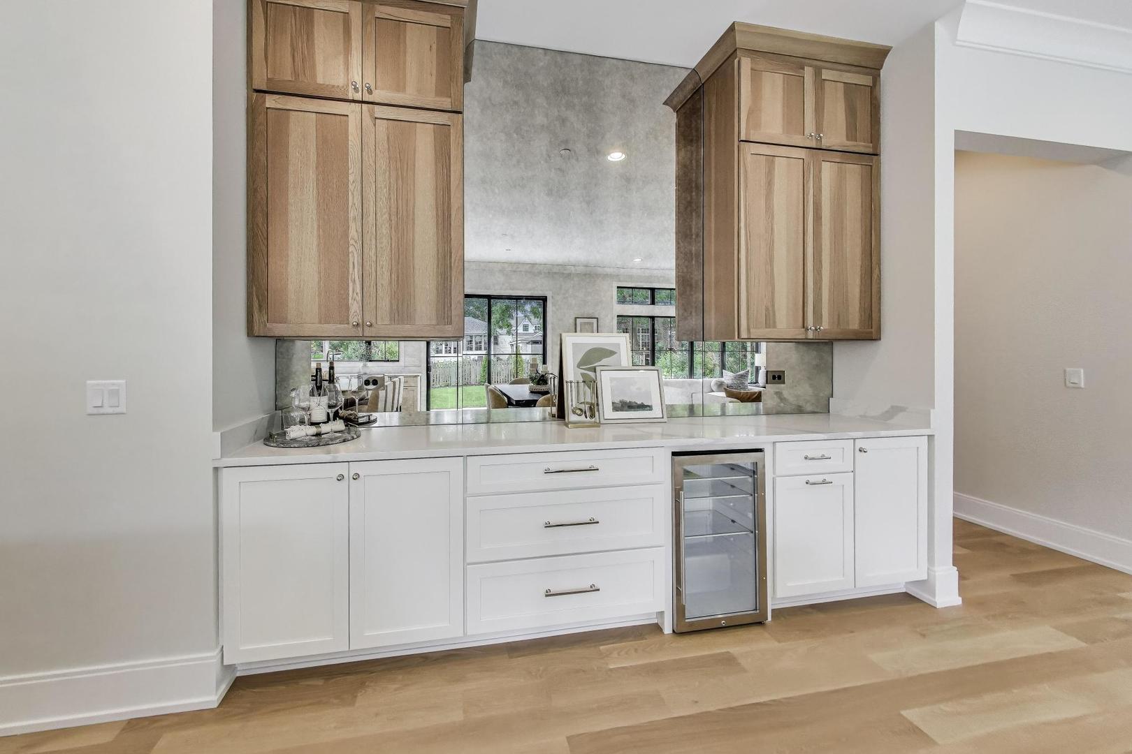 405 Ridge Avenue Clarendon Hills, IL 60514 - Photo 8 of 17 a kitchen with white cabinets and white appliances