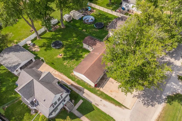an aerial view of residential house with outdoor space and street view