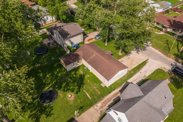 an aerial view of house with yard