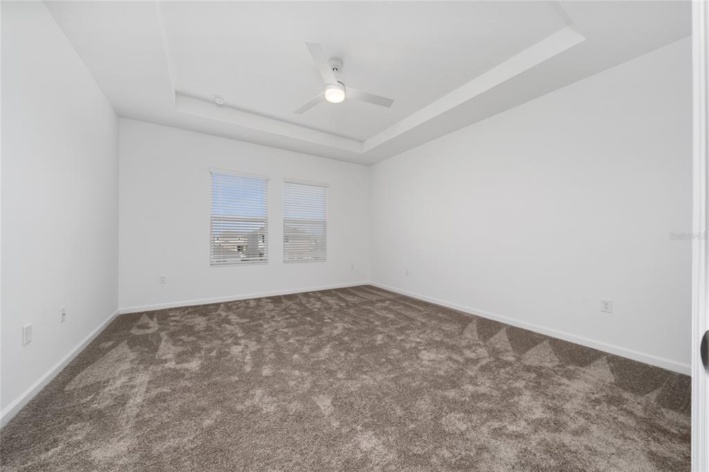 2587 Skyline Loop Kissimmee, FL 34758 - Photo 17 of 27 an empty room with a workbench