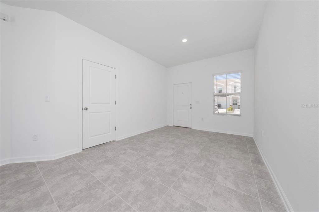 2587 Skyline Loop Kissimmee, FL 34758 - Photo 25 of 27 an empty room with windows