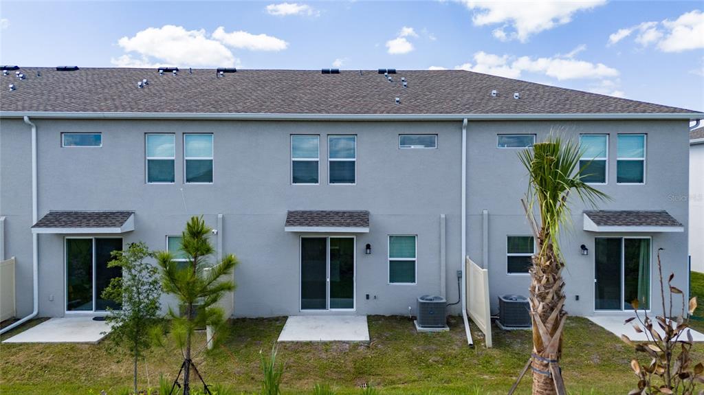 2587 Skyline Loop Kissimmee, FL 34758 - Photo 27 of 27 a front view of a house with garden