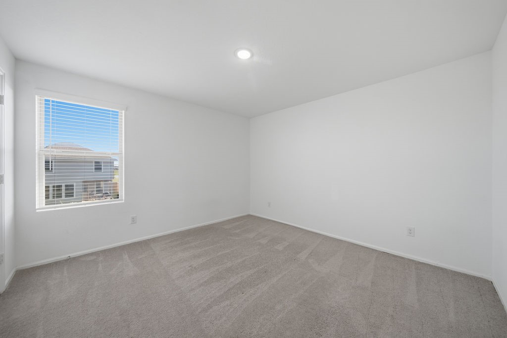 14230 Overbrook Willow Way Rosharon, TX 77583 - Photo 37 of 50 an empty room with a window
