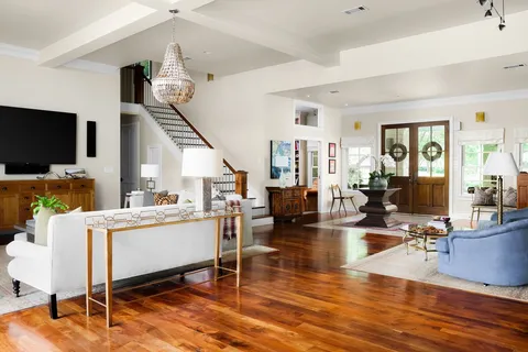 a living room with fireplace furniture and a flat screen tv