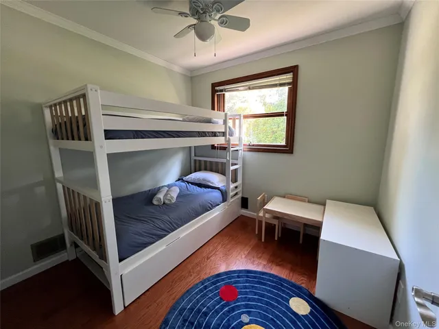 a bedroom with furniture and a window