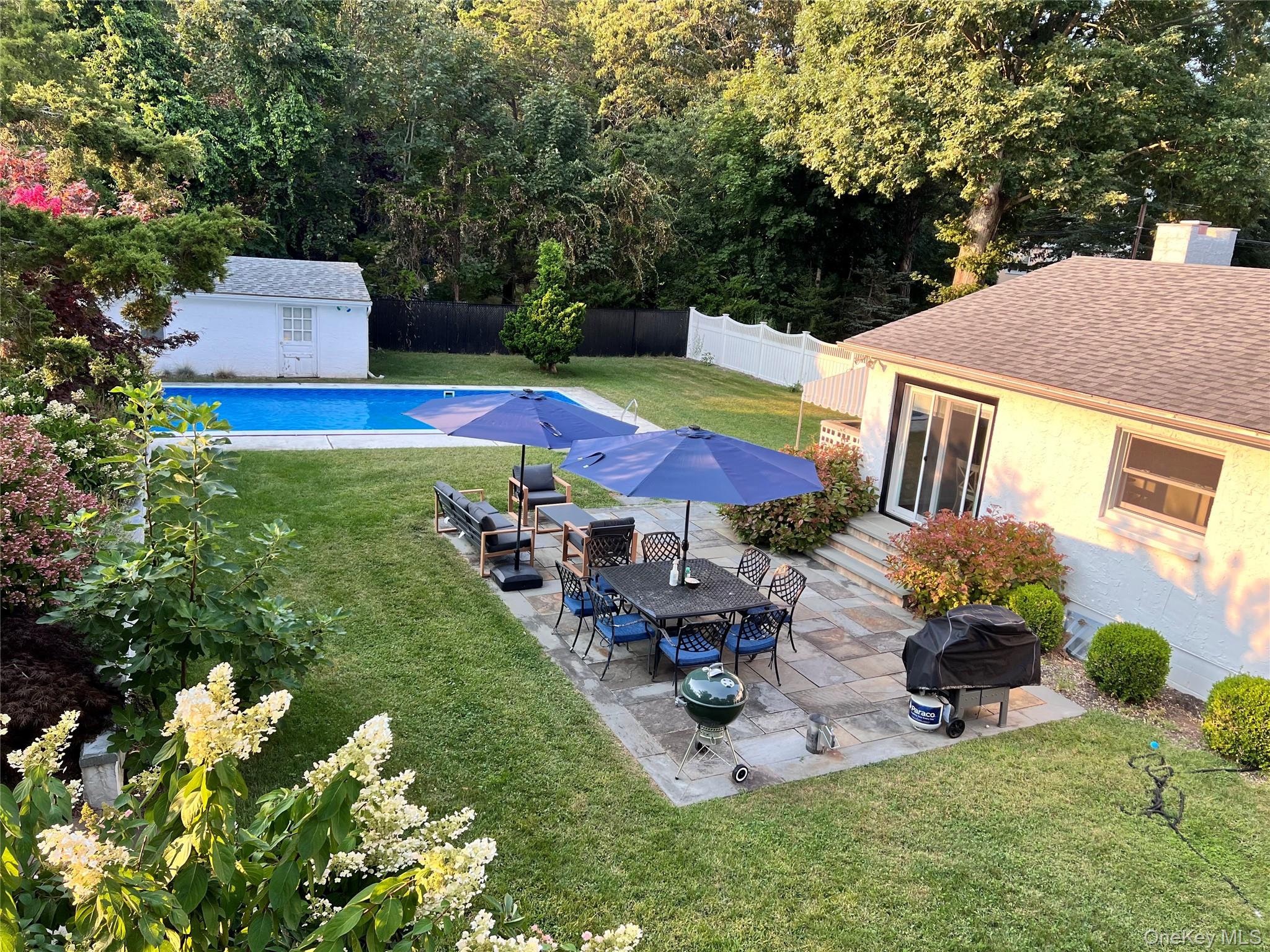 3825 Stars Road East Marion, NY 11939 - Photo 2 of 14 3825 Stars Road - In Ground Pool & Patio Area