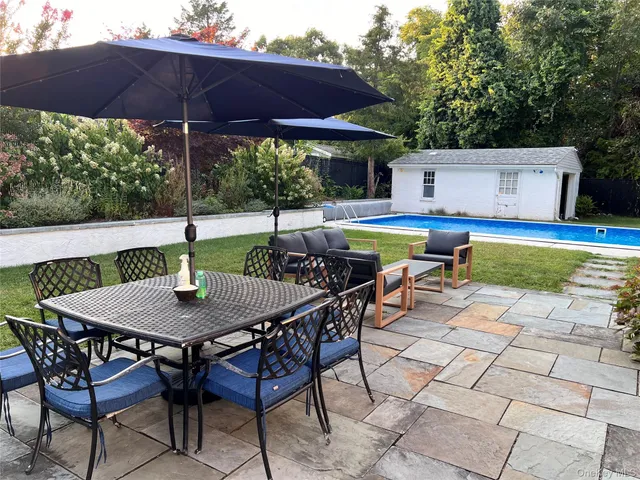 a view of an outdoor space with swimming pool