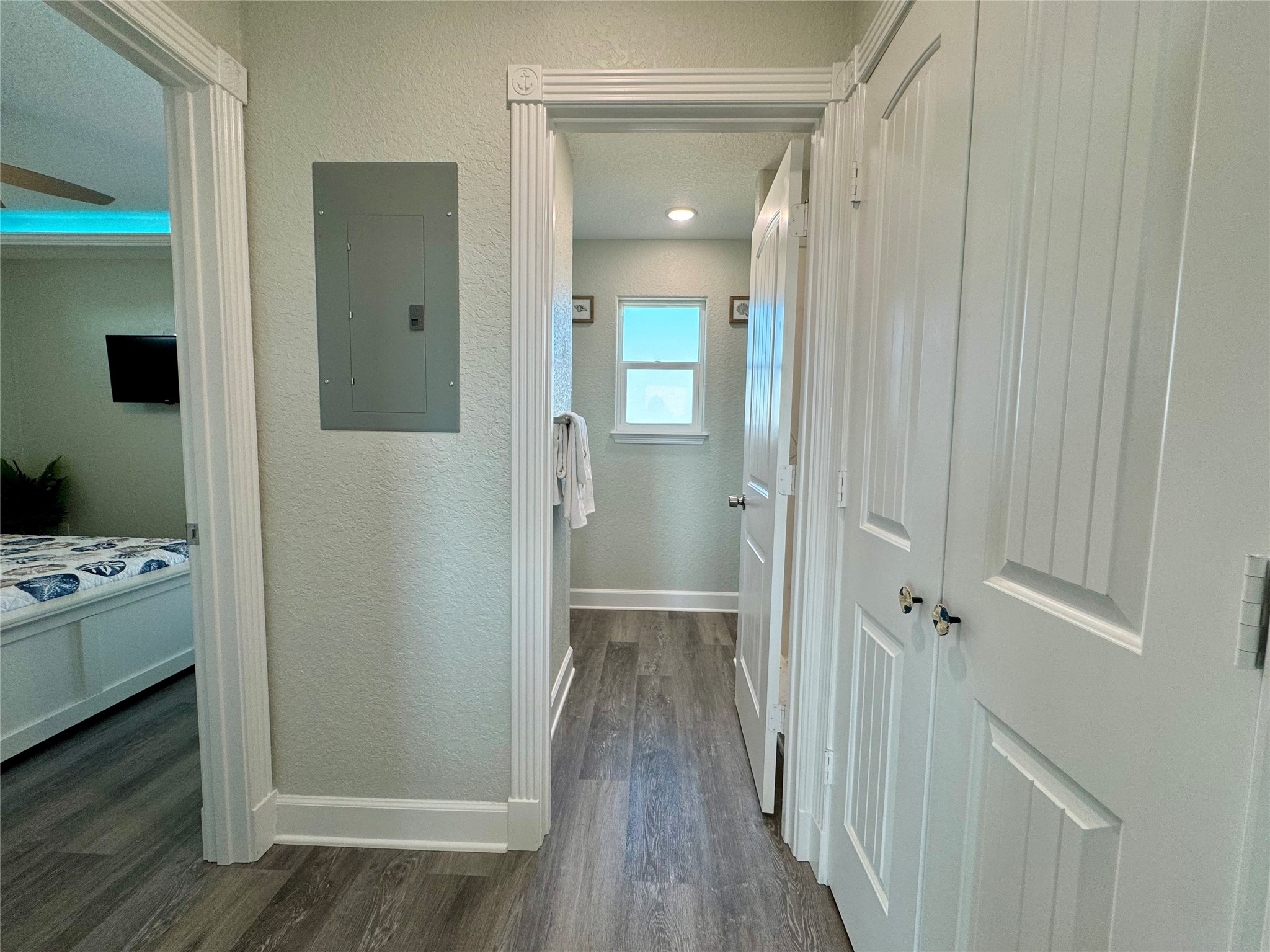 4822 Palm Street Surfside Beach, TX 77541 - Photo 14 of 32 Laundry room on right, bathroom ahead, bedroom with private balcony access on left.