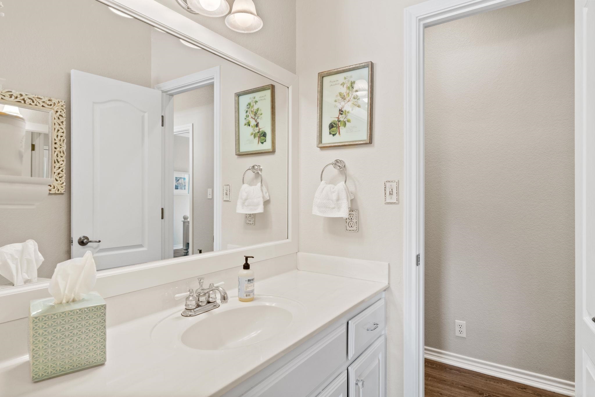 2409 Mormon Mill Road Marble Falls, TX 78654 - Photo 14 of 30 a bathroom with a sink and a mirror