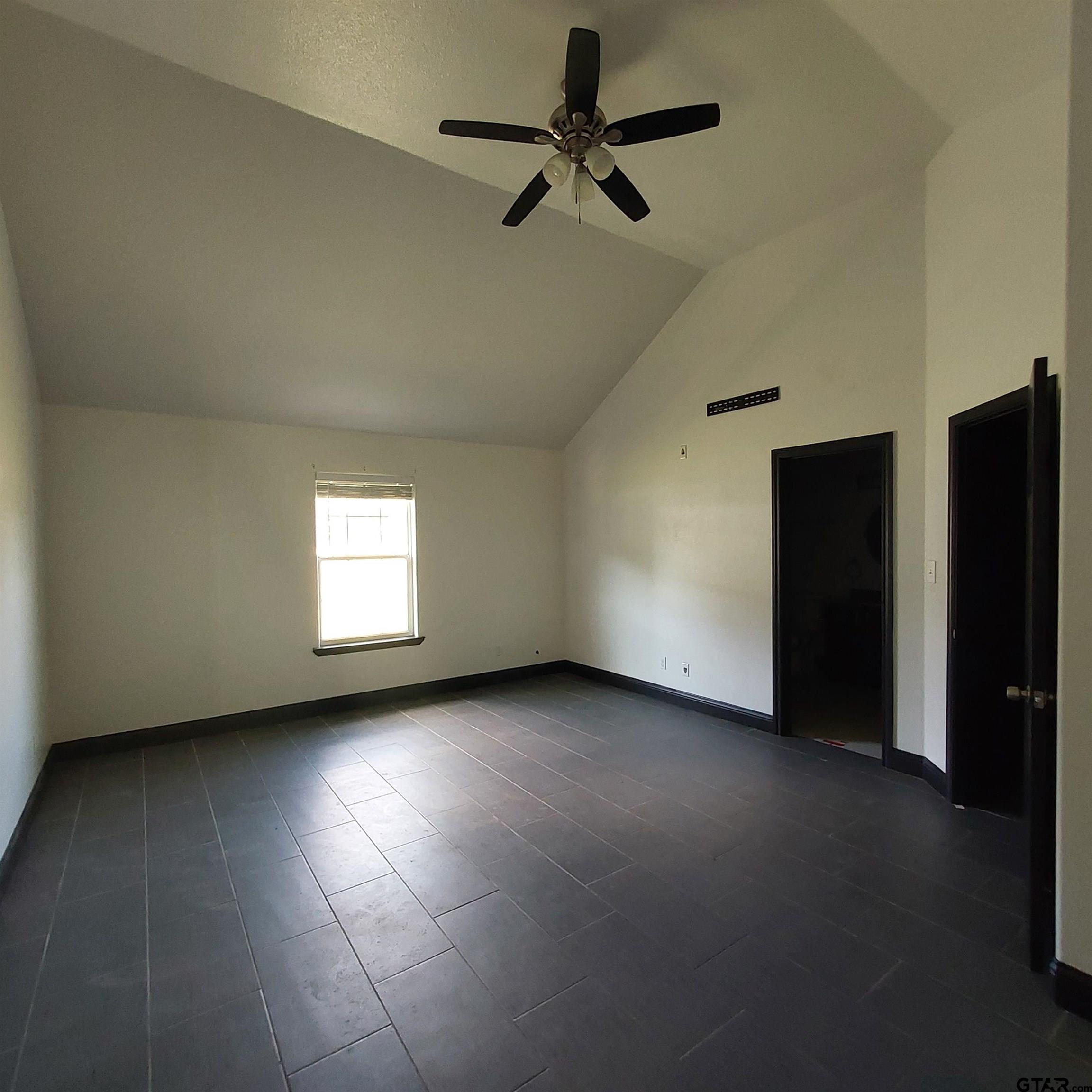 1937 Highway 11 Pittsburg, TX 75686 - Photo 15 of 33 a view of a livingroom with a ceiling fan and window