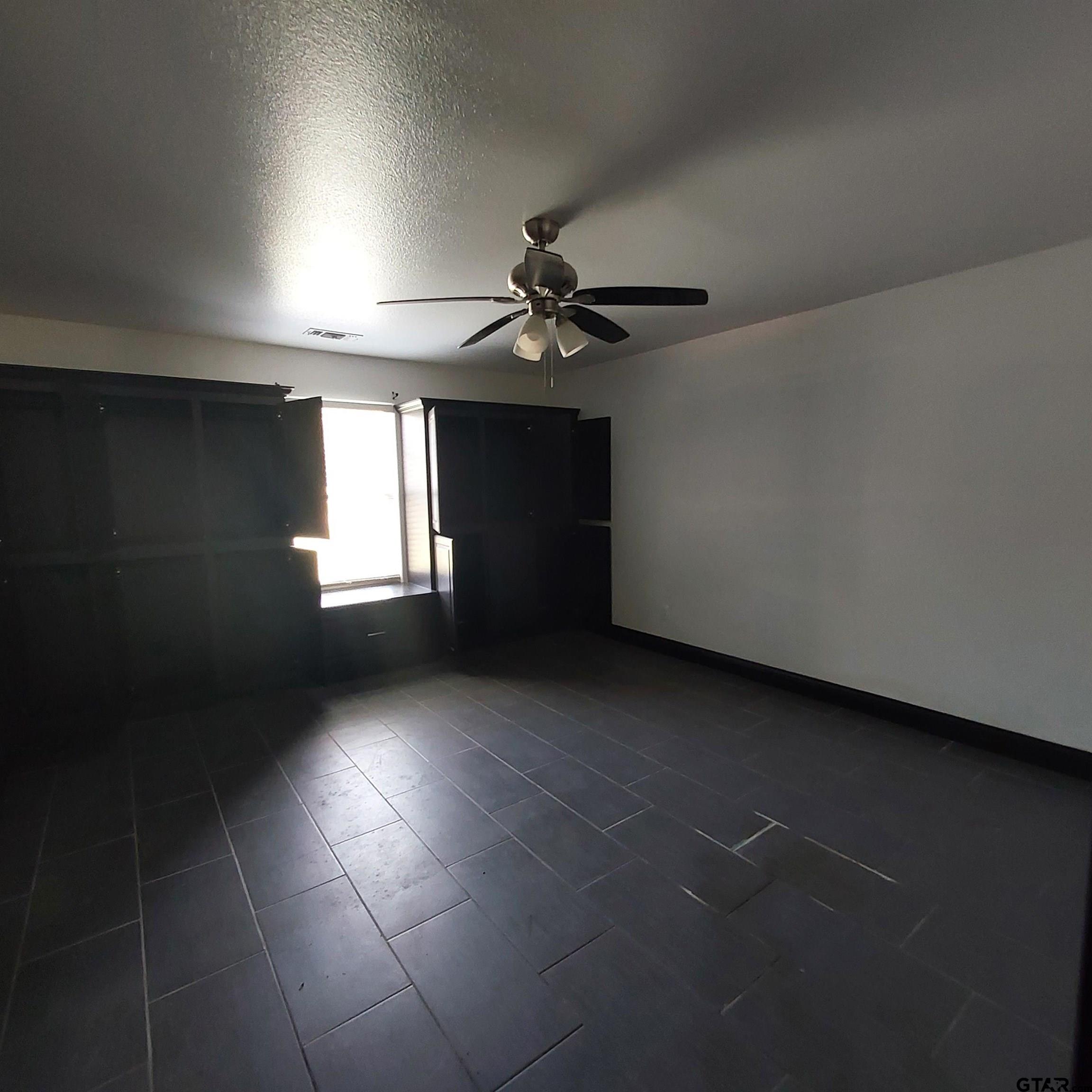 1937 Highway 11 Pittsburg, TX 75686 - Photo 16 of 33 a view of an empty room with a window