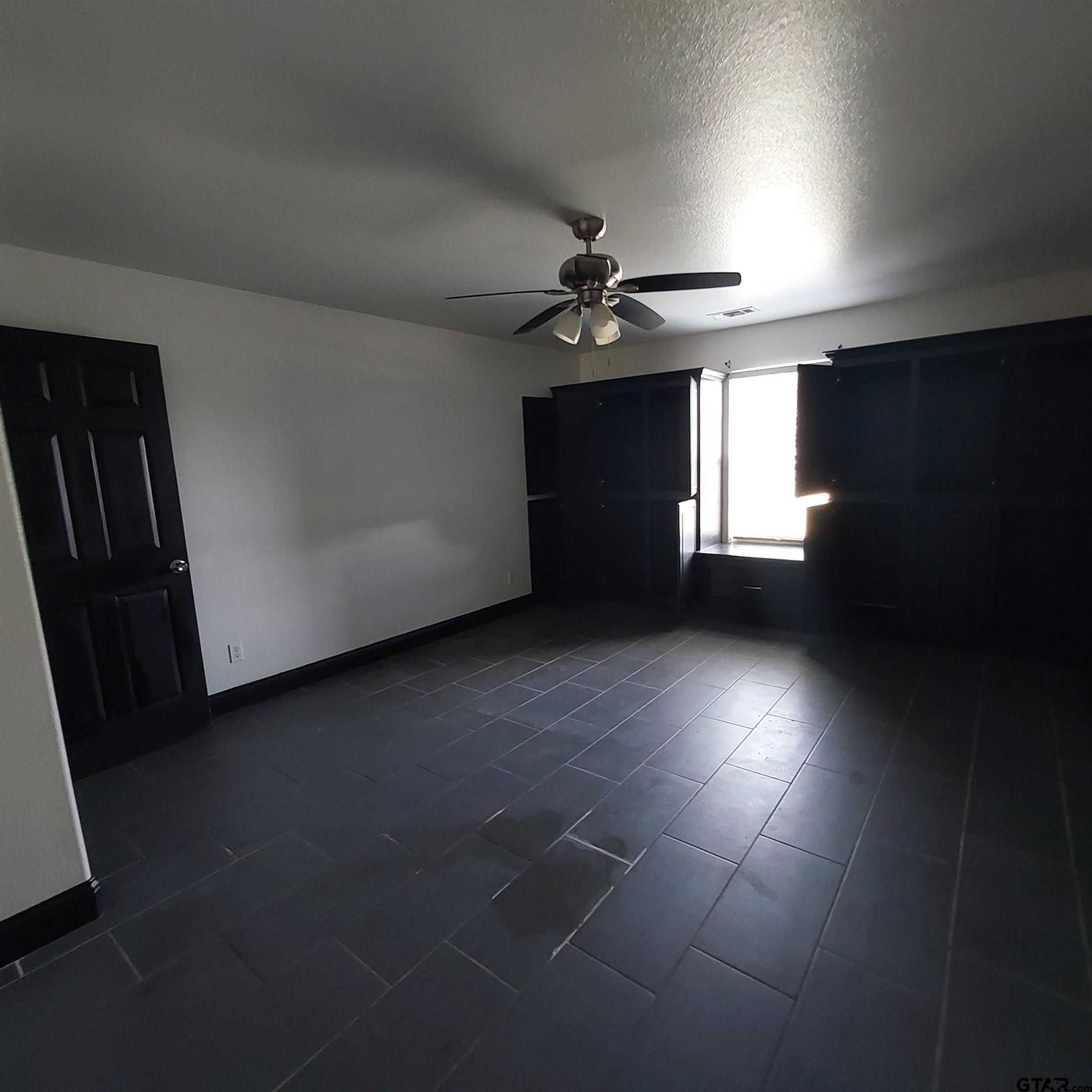 1937 Highway 11 Pittsburg, TX 75686 - Photo 17 of 33 a view of an empty room with a window