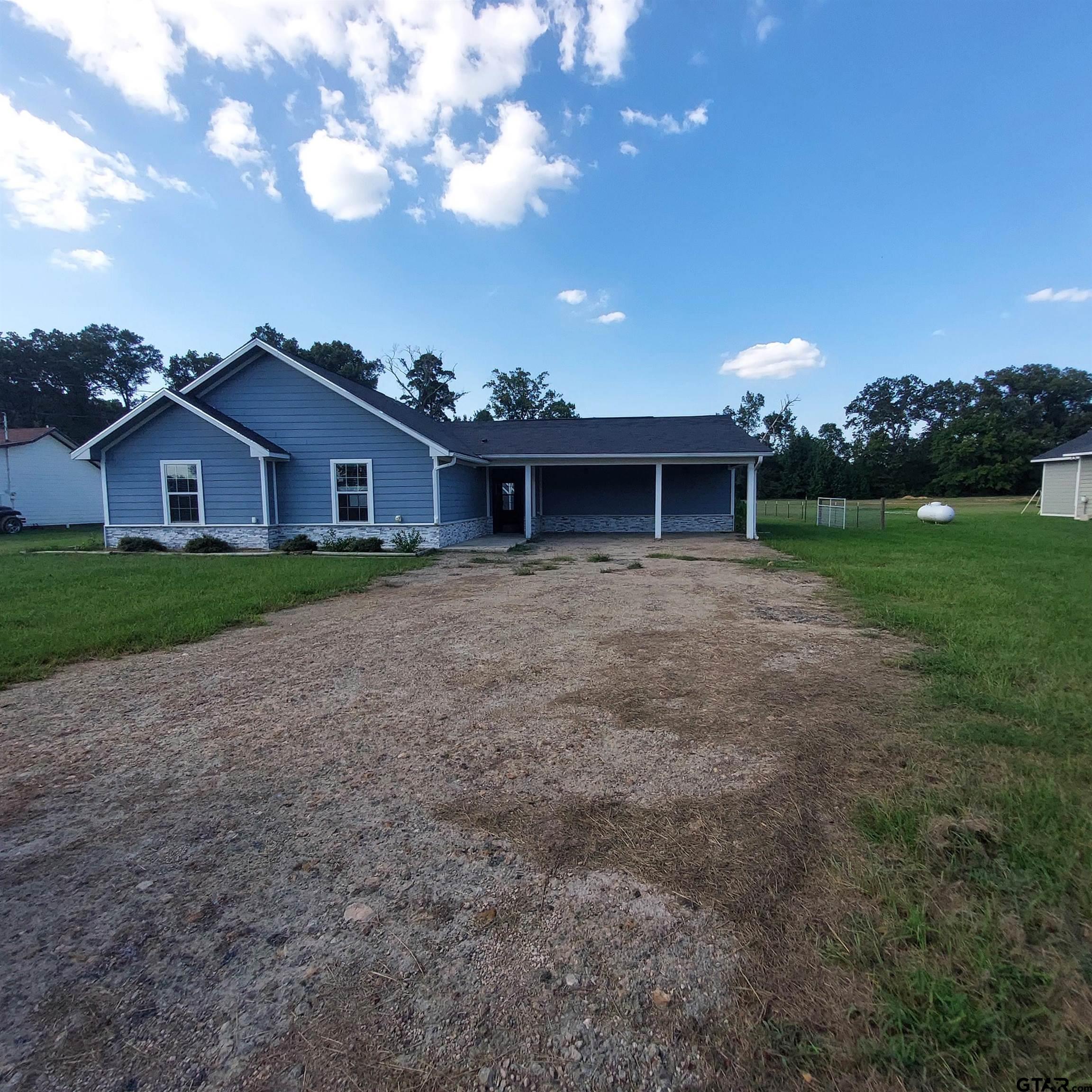 1937 Highway 11 Pittsburg, TX 75686 - Photo 19 of 33 a front view of house with yard and green space