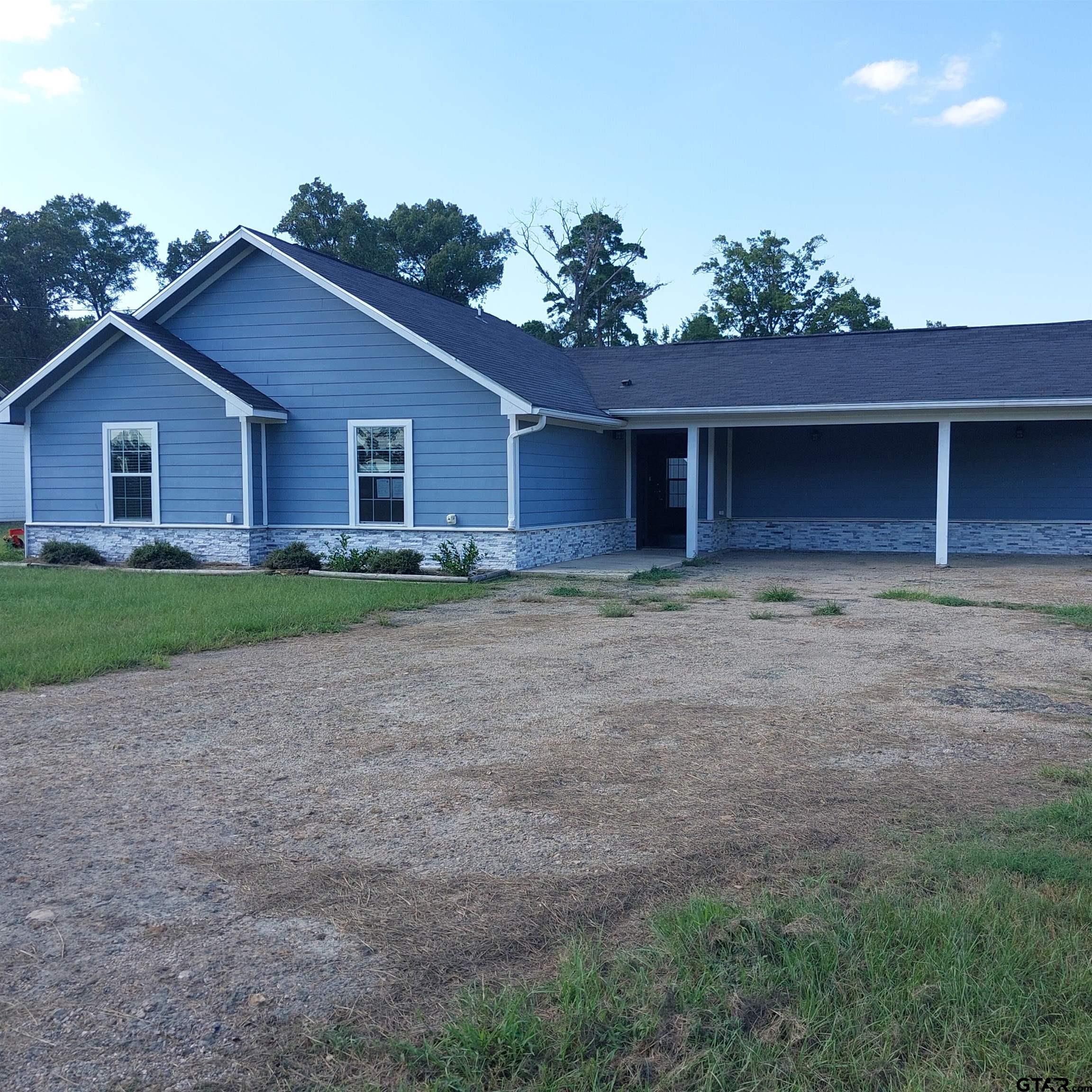 1937 Highway 11 Pittsburg, TX 75686 - Photo 20 of 33 a view of a house with a yard