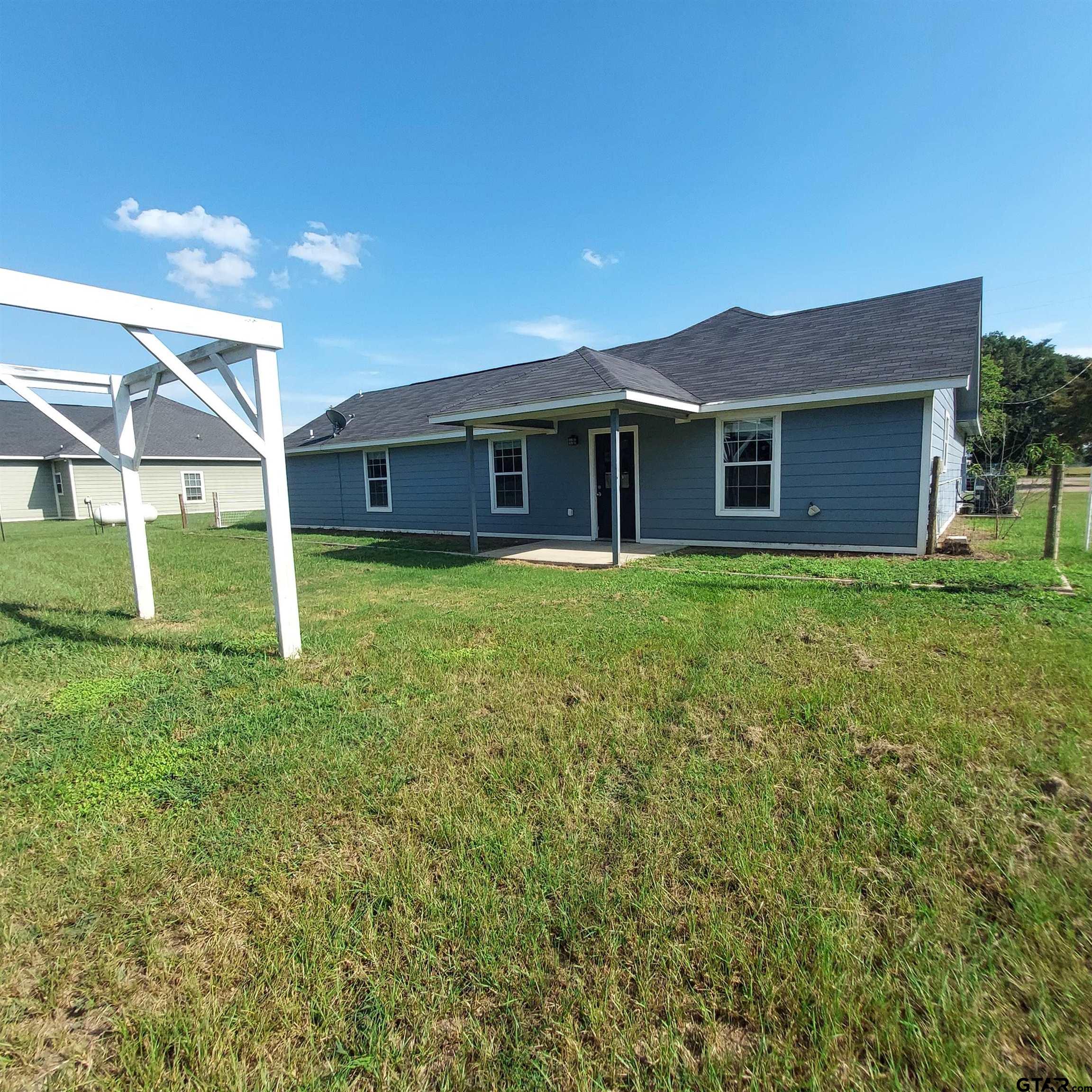 1937 Highway 11 Pittsburg, TX 75686 - Photo 24 of 33 a view of a house with a yard
