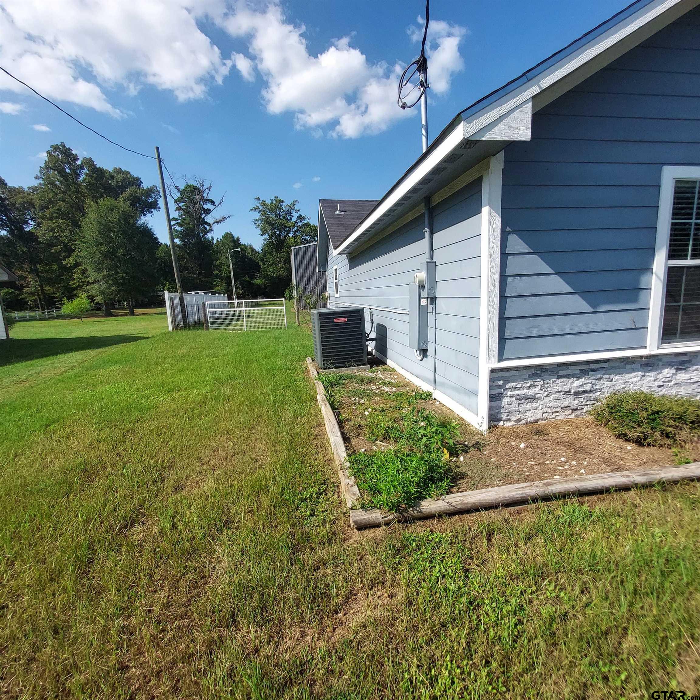 1937 Highway 11 Pittsburg, TX 75686 - Photo 25 of 33 a view of a house with backyard and porch